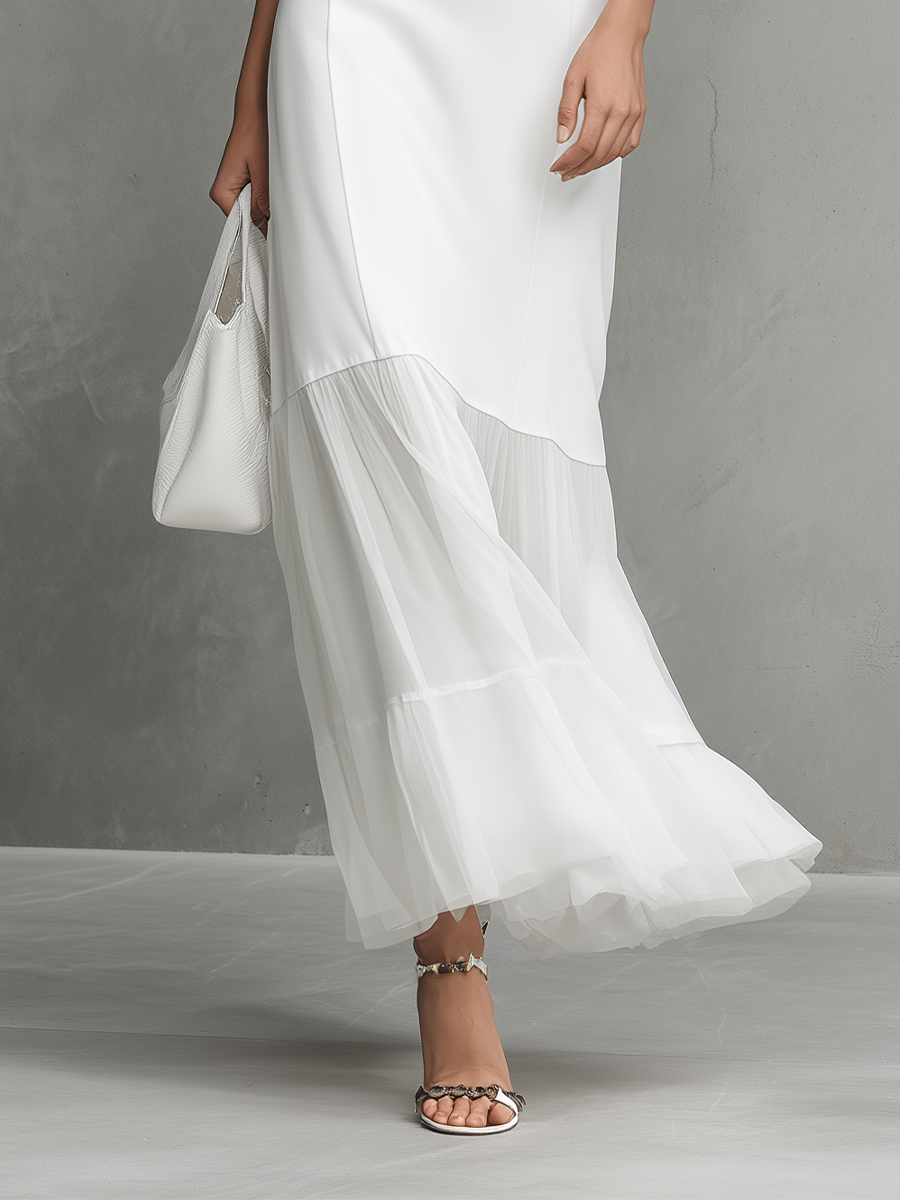 Robe élégante blanche sans manches pour femme avec panneaux en soie lactée et mousseline